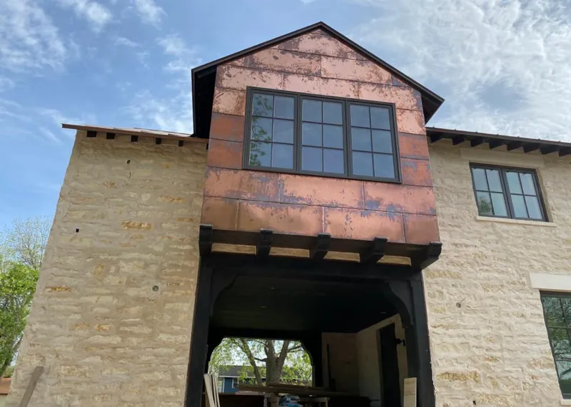 Copper metal panel facade on a stone building for Skylight Installation in Mentone