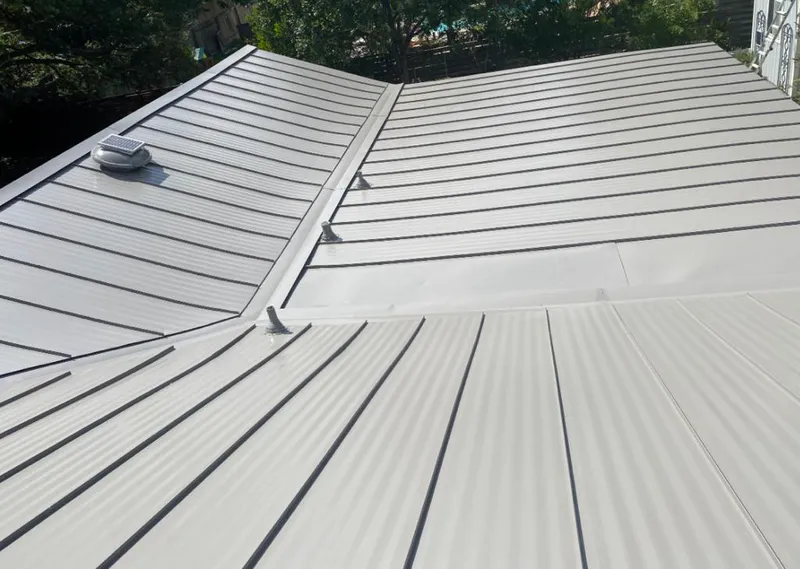 Solar attic fan installed on a metal roof for Roof Ventilation in Mentone